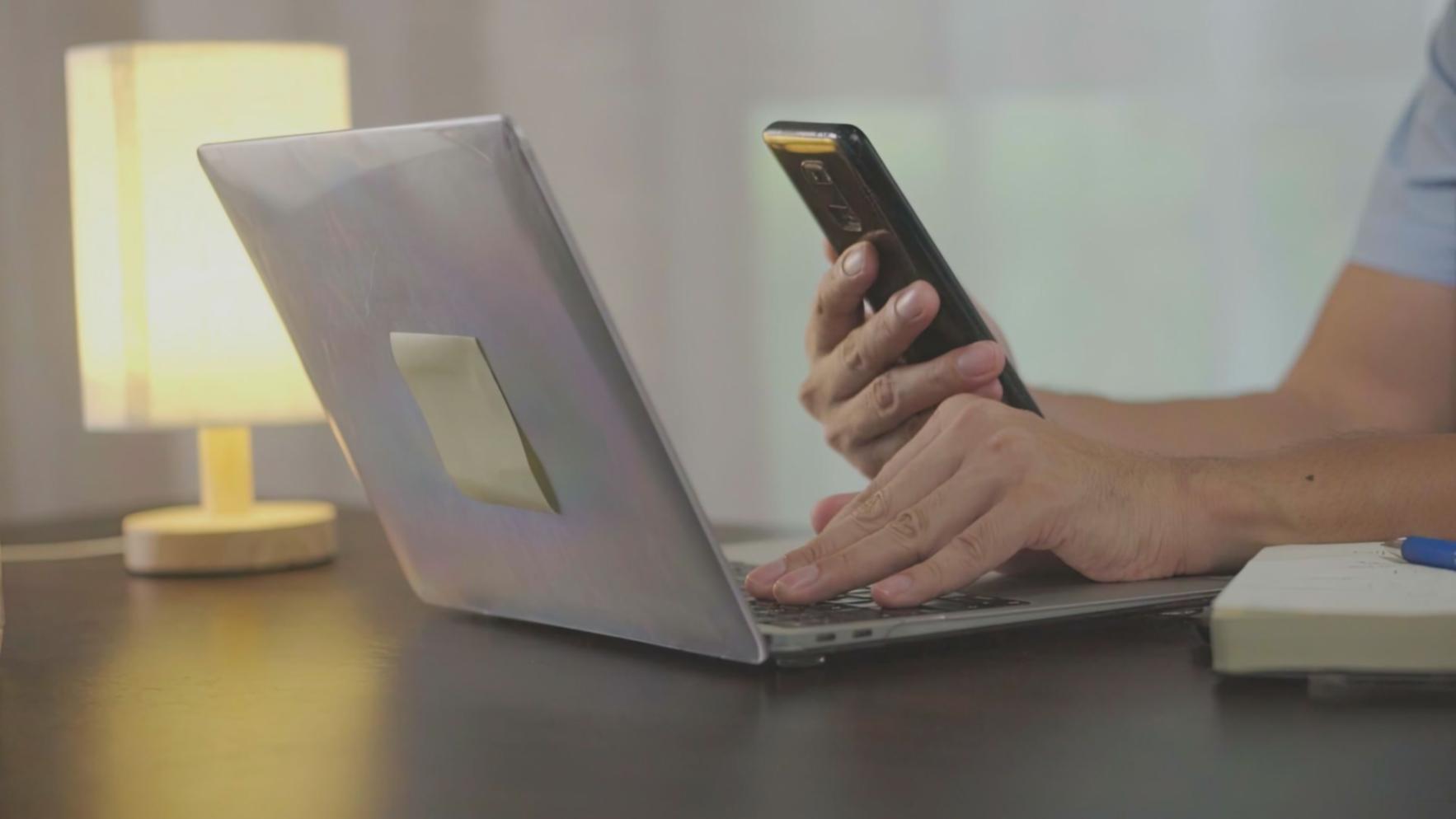 Students using mobile banking apps and Australian financial planning tools during practical workshop session